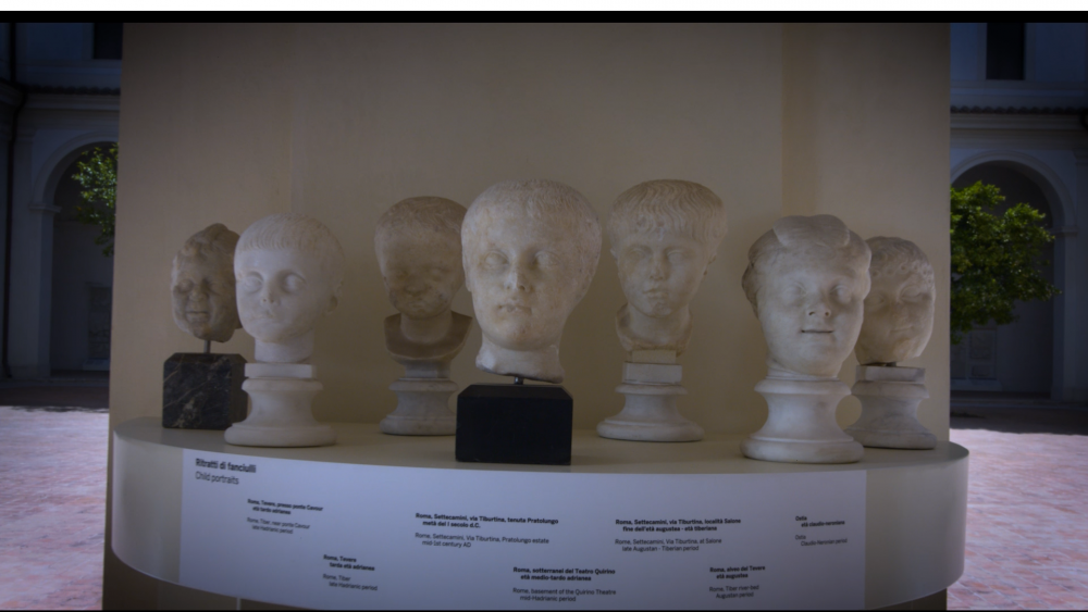 Seven marble busts of children's heads