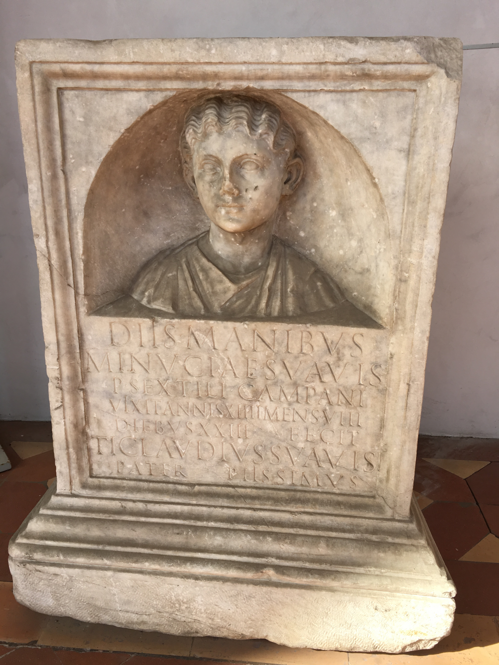 Marble monument with relief and inscription