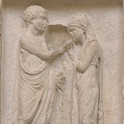 Funerary inscription and carving of a freedman and his wife